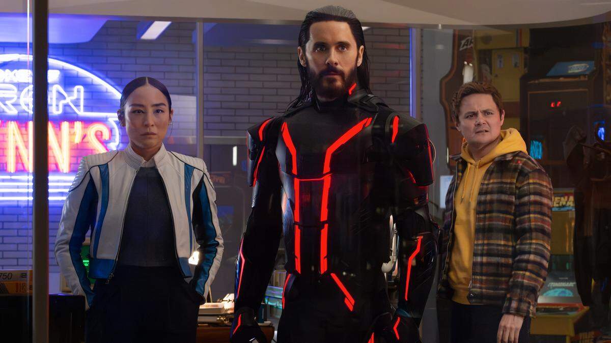 (L-R) Greta Lee as Eve Kim, Jared Leto as Ares, and Arturo Castro as Seth Flores in Disney's Live Action TRON: ARES. Photo by Leah Gallo. © 2025 Disney Enterprises, Inc. All Rights Reserved.