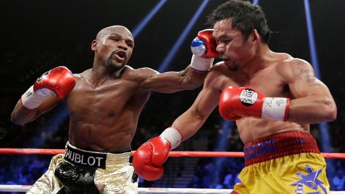 Floyd Mayweather Jr. castiga a Manny Pacquiao en la pelea por la corona welter, el 2 de mayo del 2015.