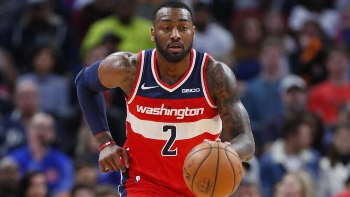 El armador de los Wizards John Wall (2) contra Pistons el 26 de diciembre en Detroit.