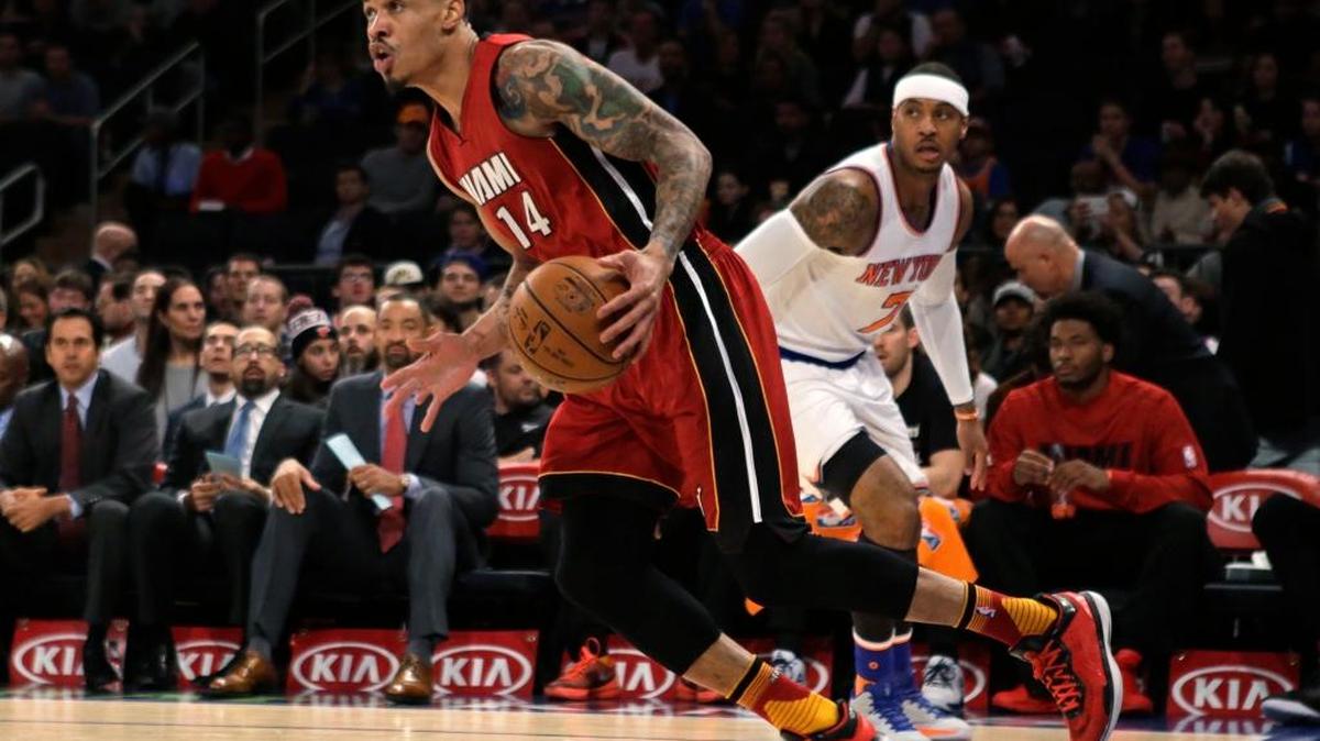 Gerald Green, del Heat (14), deja detrás a Carmelo Anthony, de los Knicks, el viernes en el Madison Square Garden.