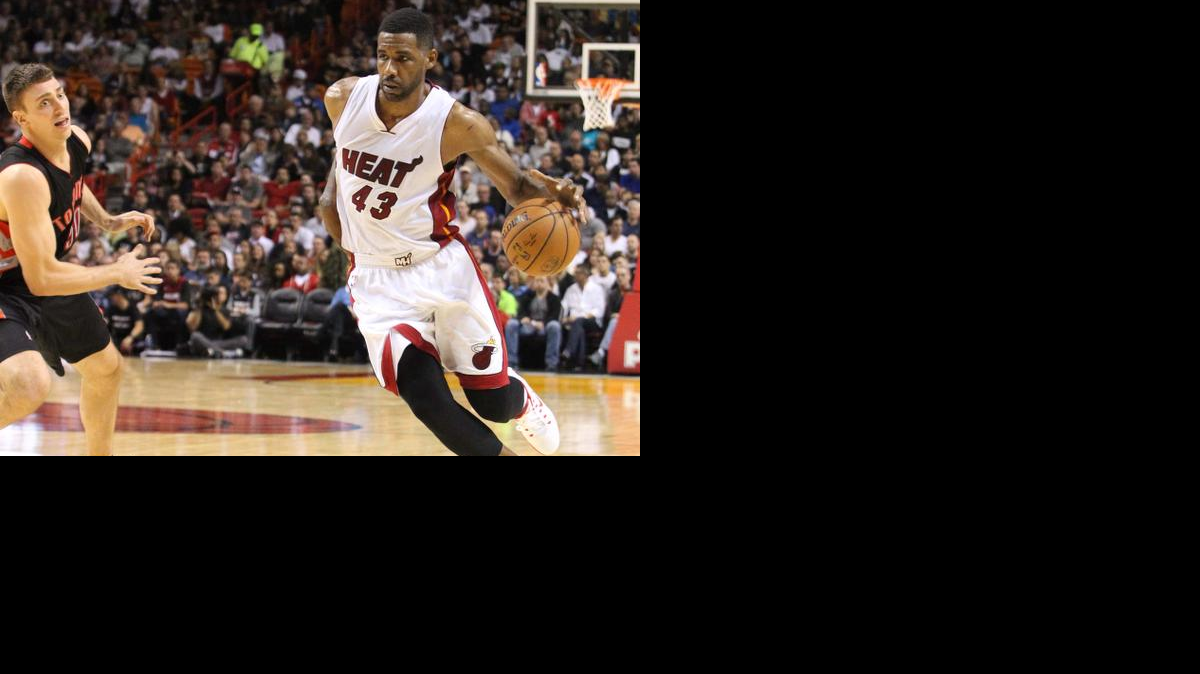 
Miami Heat Shawne Williams goes in a drive in the fourth quarter during the game Miami Heat vs Toronto Raptors at the AmericanAirlines Arena on Sunday, November 2, 2014. 
