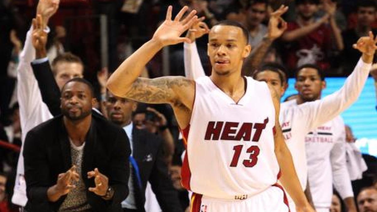 
Shabazz Napier (13) ha conseguido doble dígitos en los últimos juegos. A la izquierda, Dwyane Wade.
