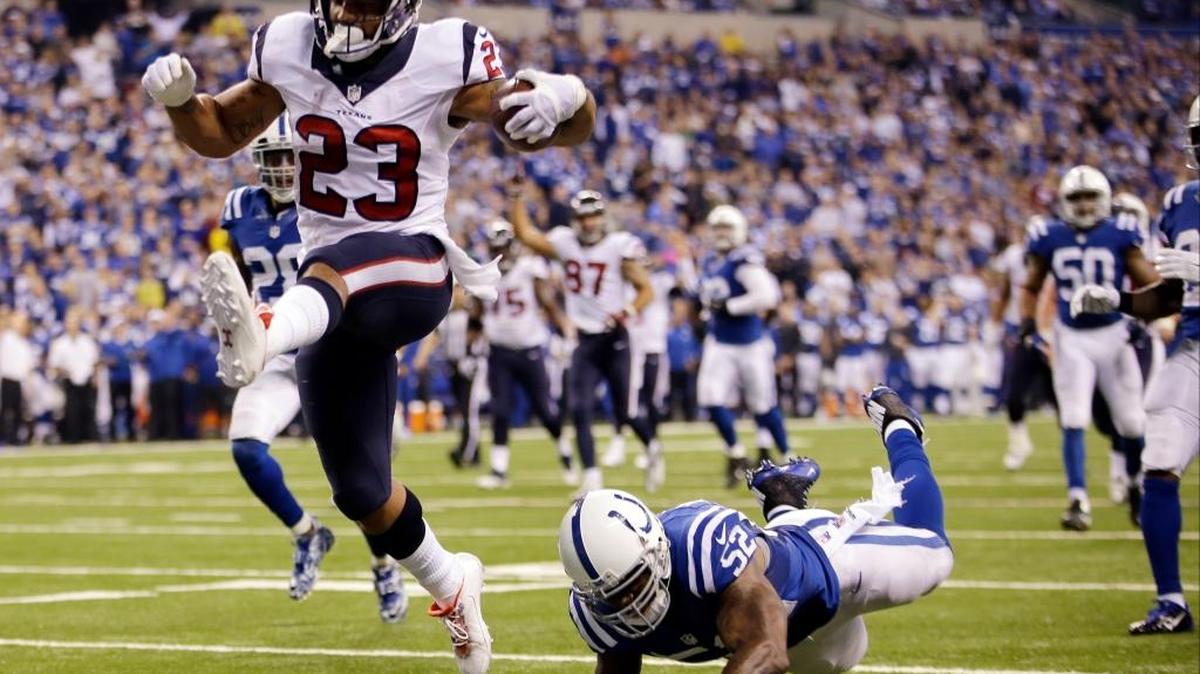 Arian Foster (23) con la camiseta de los Texans de Houston contra los Colts, en diciembre del 2014.