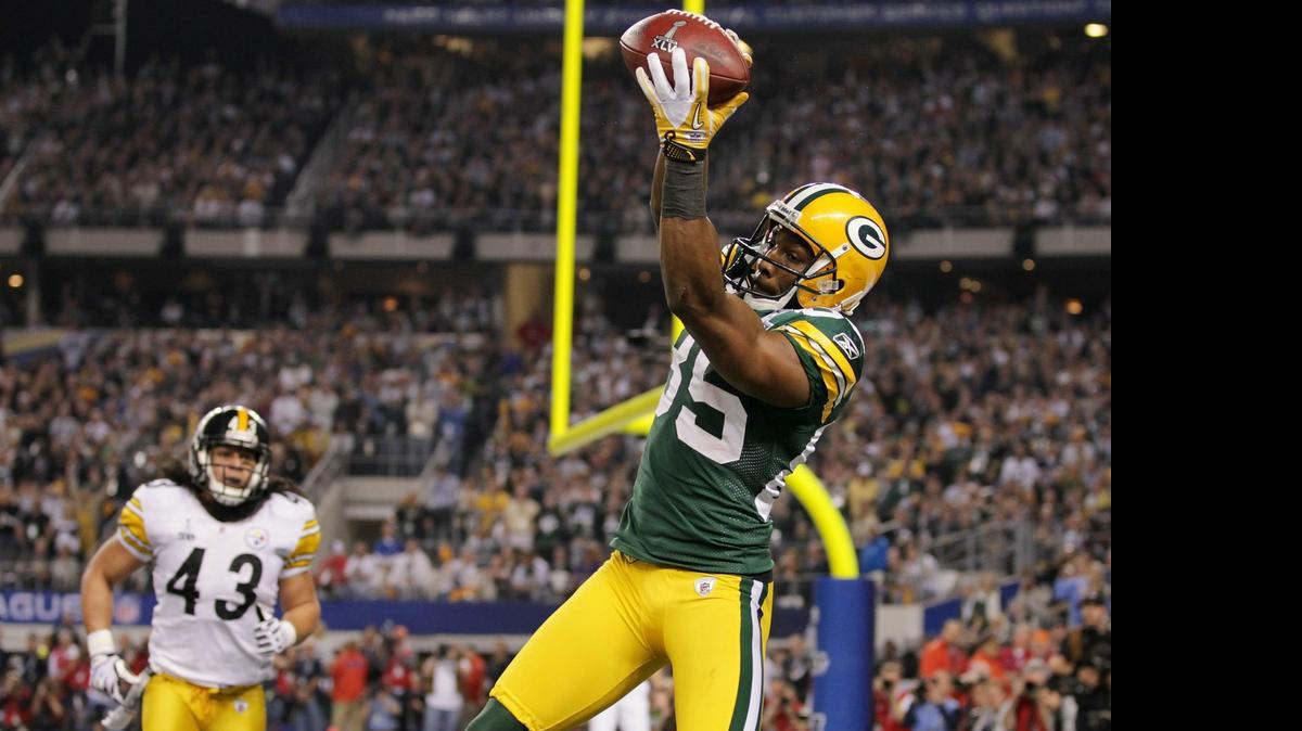 
Greg Jennings (85), de los Packers, anota un touchdowns cuando ganó el Super Bowl XLV en el 2011.
