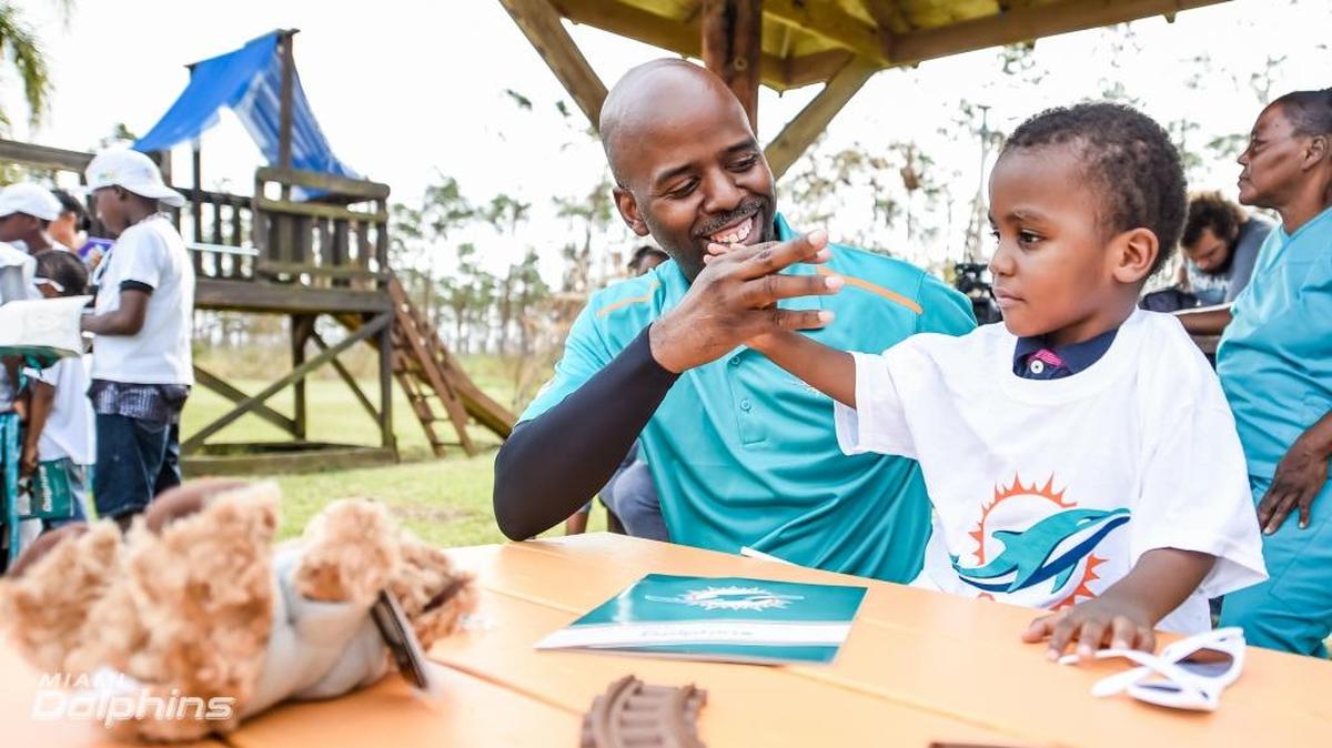 Jason Jenkins, a Miami Dolphins’ senior vice president, was a constant and compassionate presence in Miami and, pictured here, in Freeport, Bahamas.