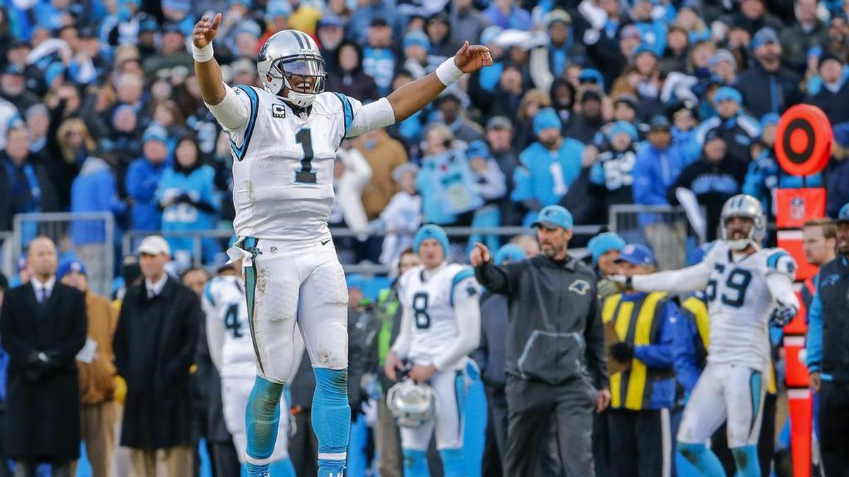 EL QUARTERBACK de las Panteras de Carolina Gam Newton celebra un touchdown durante la victoria sobre los Seahawks de Seattle en los playoffs de la Conferencia Nacional, el domingo en el Bank of America Stadium de Charlotte.