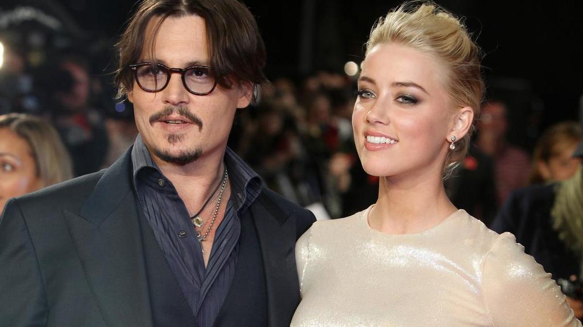 Los actores Johnny Depp y Amber Heard en una fotografía de archivo del 3 de noviembre de 2011.