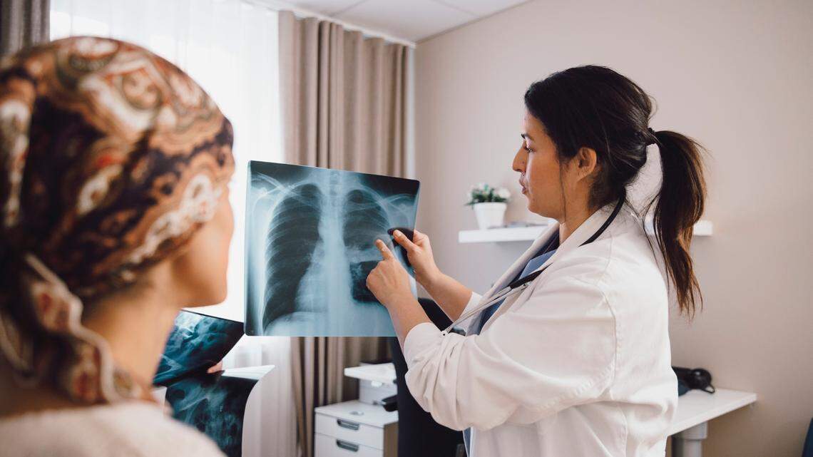 FILE: Doctor treating a cancer patient