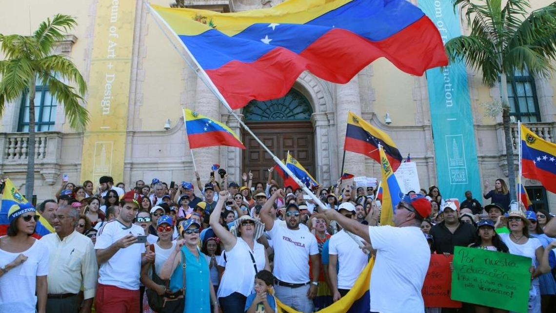 Venezuelans in Miami participate in a rally outside the Freedom Tower in 2016. As many as 200,000 Venezuelans at risk of deportation are now protected by the new Deferred Enforce Departure order.
