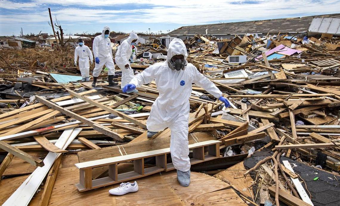 Royal Bahamas Police Crime Scene Investigators search for bodies in Marsh Harbour on Abaco Island on Sunday, Sept. 8, 2019.