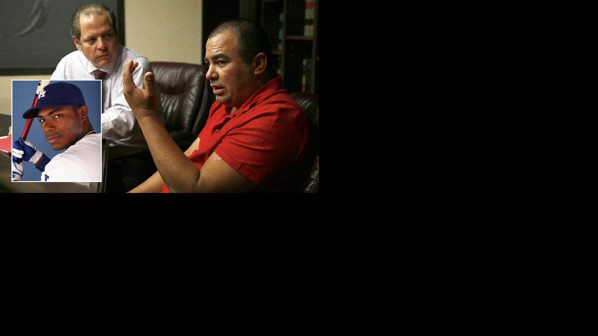 Rafael Eladio Jorge Guerra (der), habla con el Nuevo Herald sobre su papel para sacar de Cuba al pelotero Yasiel Puig. Lo acompaña el abogado Avelino González.