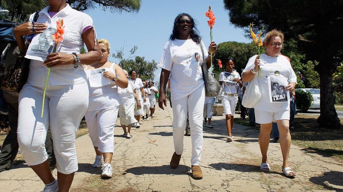 Berta Soler, center, and other women from the dissident group Ladies in White march in Havana in 2012. While the Cuban government continues to persecute such groups, according to Cuban human rights activists, the number of documented cases of human rights violations in Cuba has declined since President Donald Trump has been in office.