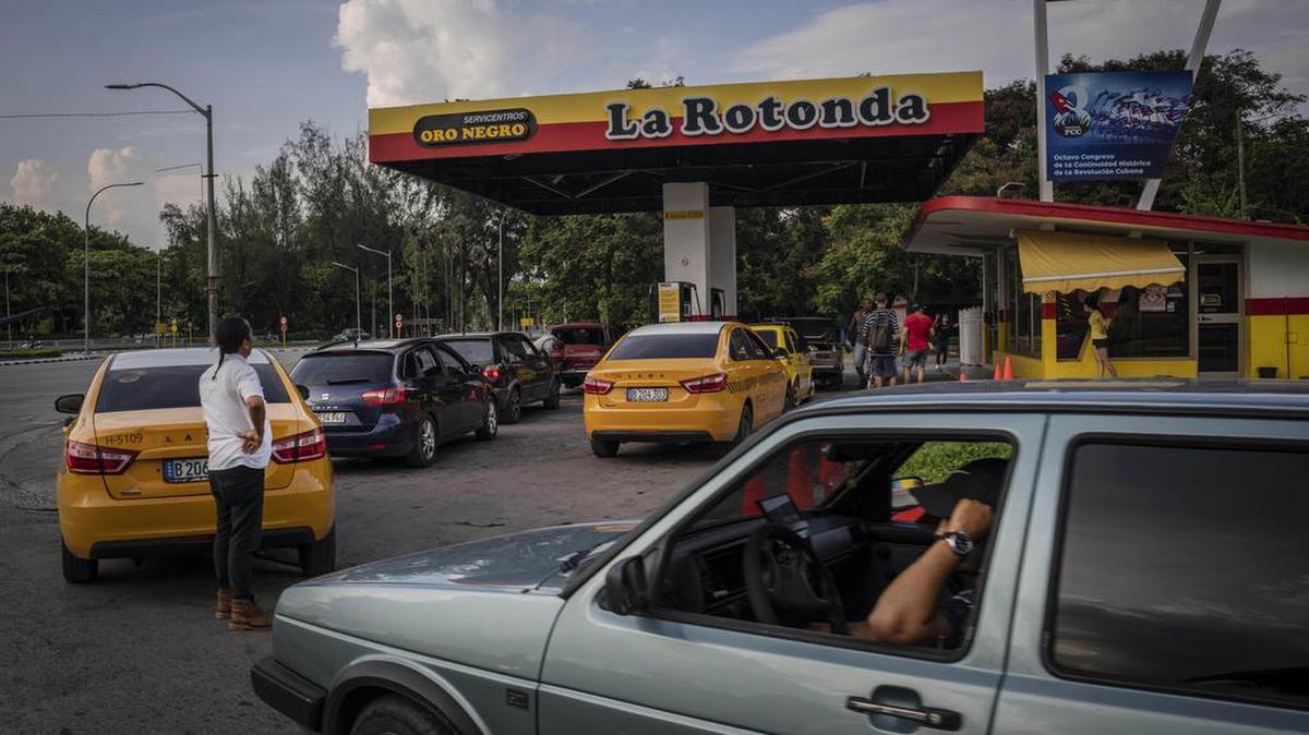 Drivers wait their turn to fuel their vehicles at a gas station in Havana, Cuba, Thursday, July 14, 2022. (AP Photo/Ramon Espinosa)