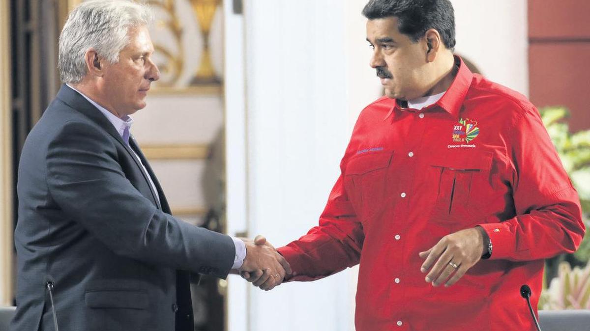 Cuba’s President Miguel Diaz-Canel, left, shakes hands with his Venezuelan counterpart Nicolas Maduro during the closing ceremony of the Sao Paulo Forum at Miraflores presidential palace in Caracas, Venezuela, Sunday, July 28, 2019. The Sao Paulo forum, held almost annually and hosted by Cuba last year, was founded as Latin American leftists sought to re-organize after the fall of the Berlin Wall in 1989. (AP Photo/Ariana Cubillos)