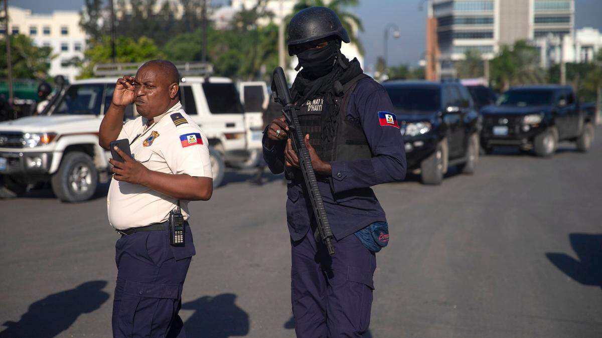 Armed forces secure the area where the Haiti’s Prime Minister Ariel Henry placed a bouquet of flowers in front of independence hero Jean Jacques Dessalines memorial in Port-au-Prince, Haiti, Sunday, Oct. 17, 2021. A group of 17 missionaries including children was kidnapped by a gang in Haiti on Saturday, according to a voice message sent to various religious missions by an organization with direct knowledge of the incident. (AP Photo/Joseph Odelyn)