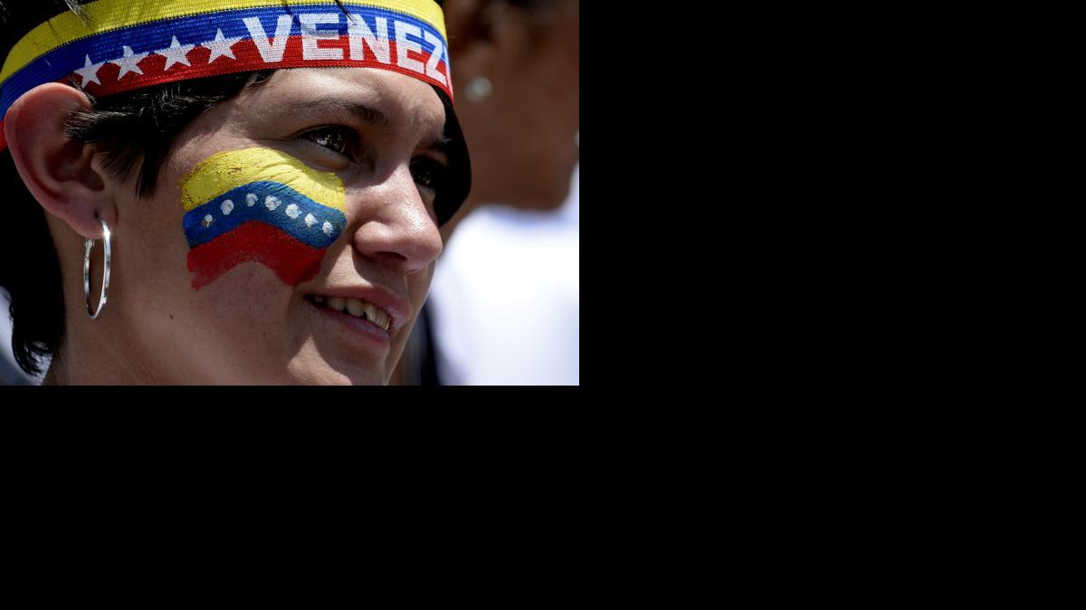
Una mujer partidaria de la oposición durante la marcha del domingo 08 de marzo de 2015, durante el Día Internacional de la Mujer. 

