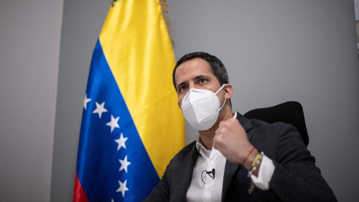 Venezuelan opposition leader and self-proclaimed acting president Juan Guaido gestures during an interview with AFP at his home in Caracas on November 30, 2020. (Photo by Yuri CORTEZ / AFP) (Photo by YURI CORTEZ/AFP via Getty Images)