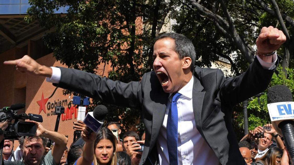 Venezuelan opposition leader Juan Guaidó speaks as he’s surrounded by reporters on his way to the National Assembly in Caracas on Monday, Jan. 7, 2020.