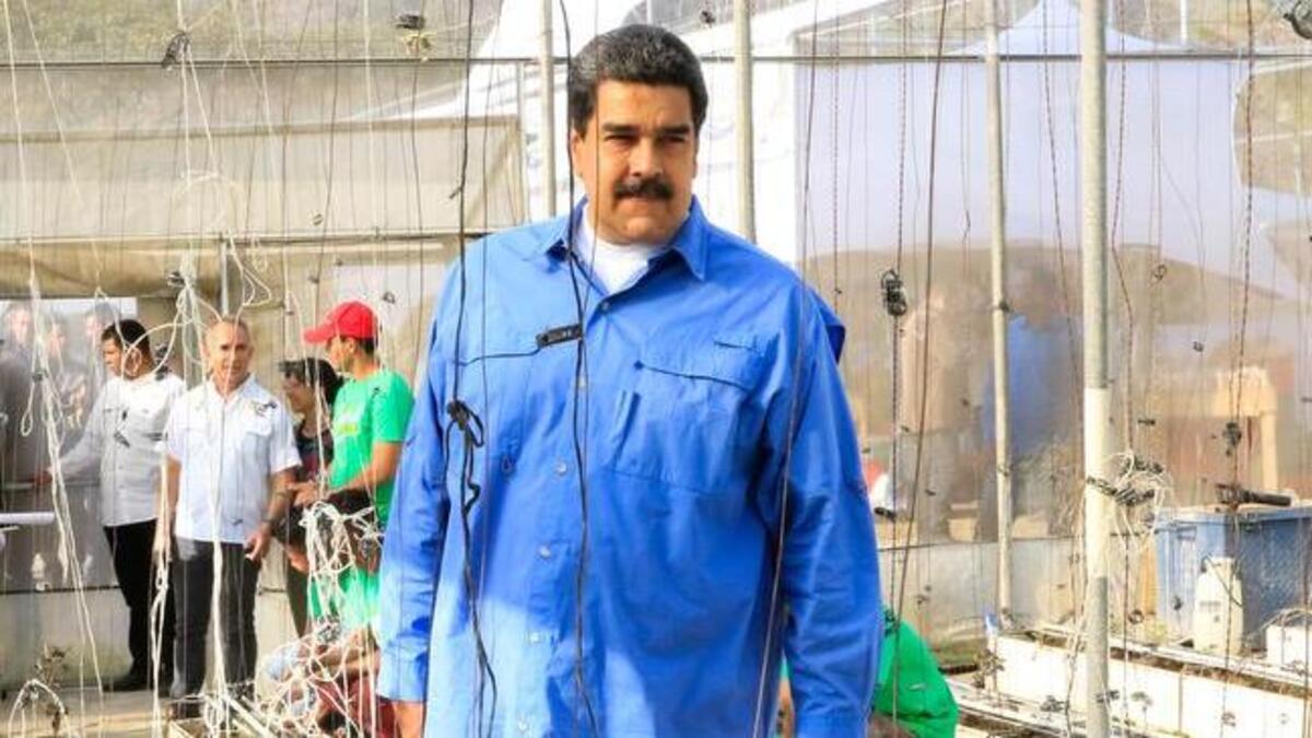 El presidente venezolano Nicolás Maduro (c) encabeza una alocución televisada el lunes 12 de marzo de 2018, en Caracas (Venezuela).