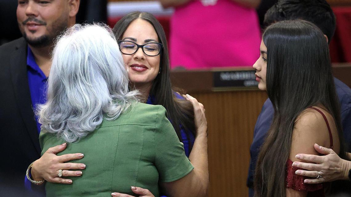 Jacqueline García-Roves, right, hugs her mother, Tania Garcia-Roves, after being sworn in as interim mayor of Hialeah on Monday.