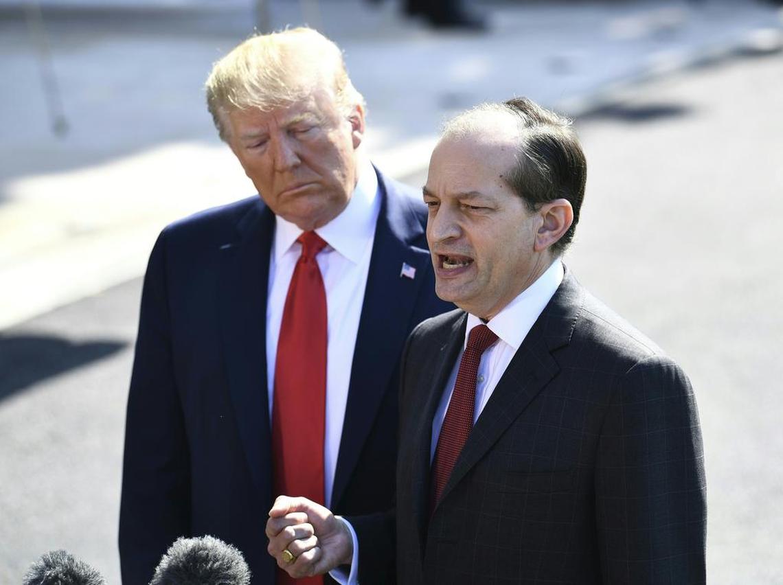 President Donald Trump listens July 12, 2019, as Secretary of Labor Alexander Acosta discusses his exit from the president’s Cabinet.