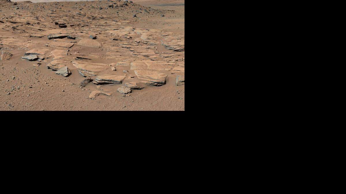 
El ultimo análisis se basa en rocas descubiertas en las laderas del Monte Sharp, que se localiza, extrañamente, en el centro de un cráter de Marte
