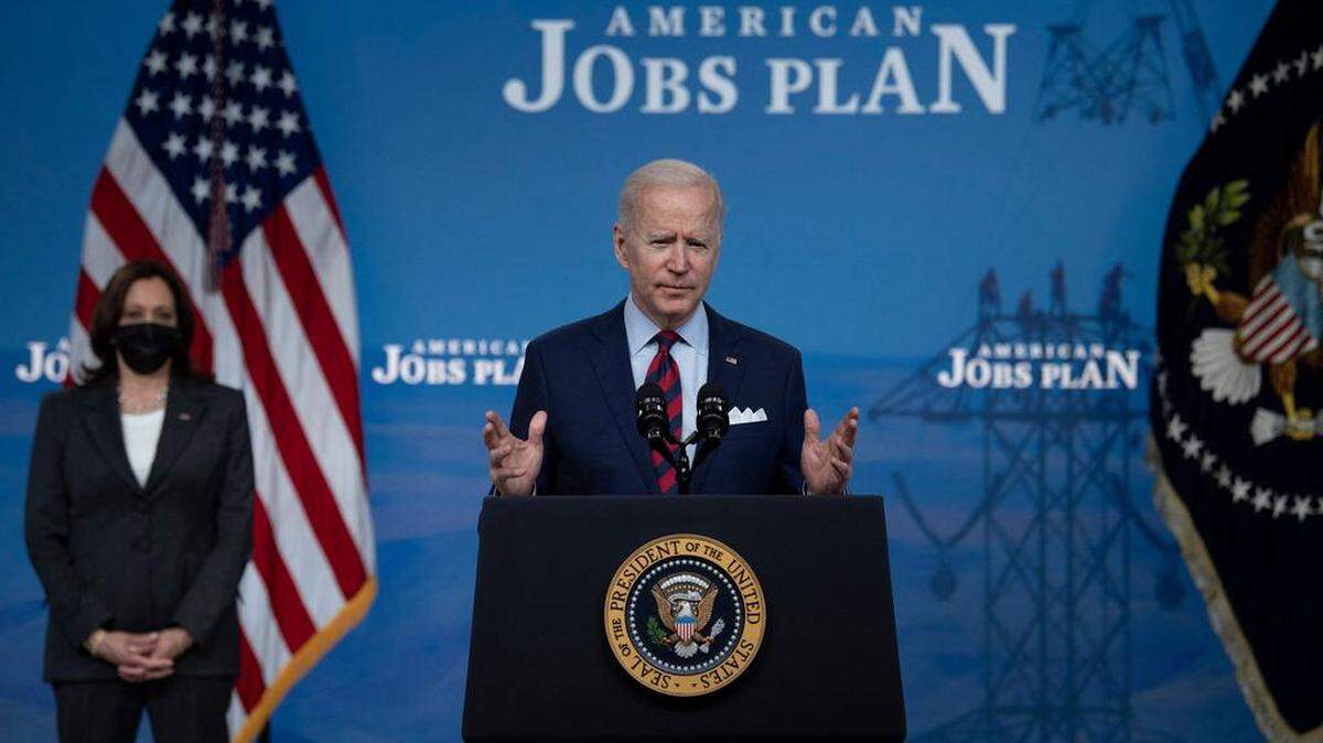 US President Joe Biden, with Vice President Kamala Harris, speaks about infrastructure investment from the Eisenhower Executive Office Building on the White House campus on April 7, 2021, in Washington, DC. - Biden on Wednesday said Congress should pass his $2 trillion infrastructure plan to ensure US global leadership in the face of rising power China. (Photo by Brendan Smialowski / AFP) (Photo by BRENDAN SMIALOWSKI/AFP via Getty Images)