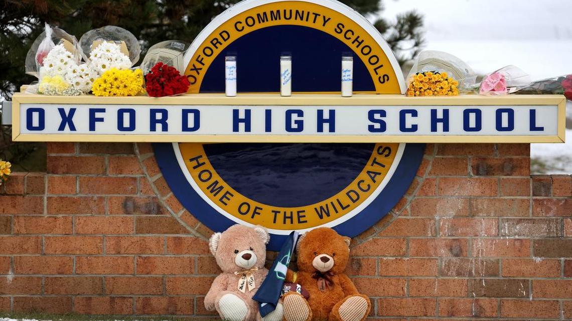 OXFORD, MICHIGAN - DECEMBER 01: Stuffed bears and flowers are gathered at a makeshift memorial outside of Oxford High School on December 01, 2021 in Oxford, Michigan. Yesterday, four students were killed and seven injured when a gunman opened fire on students at the school. A 15-year-old sophomore, believed to be the only gunman, is in custody, (Photo by Scott Olson/Getty Images)