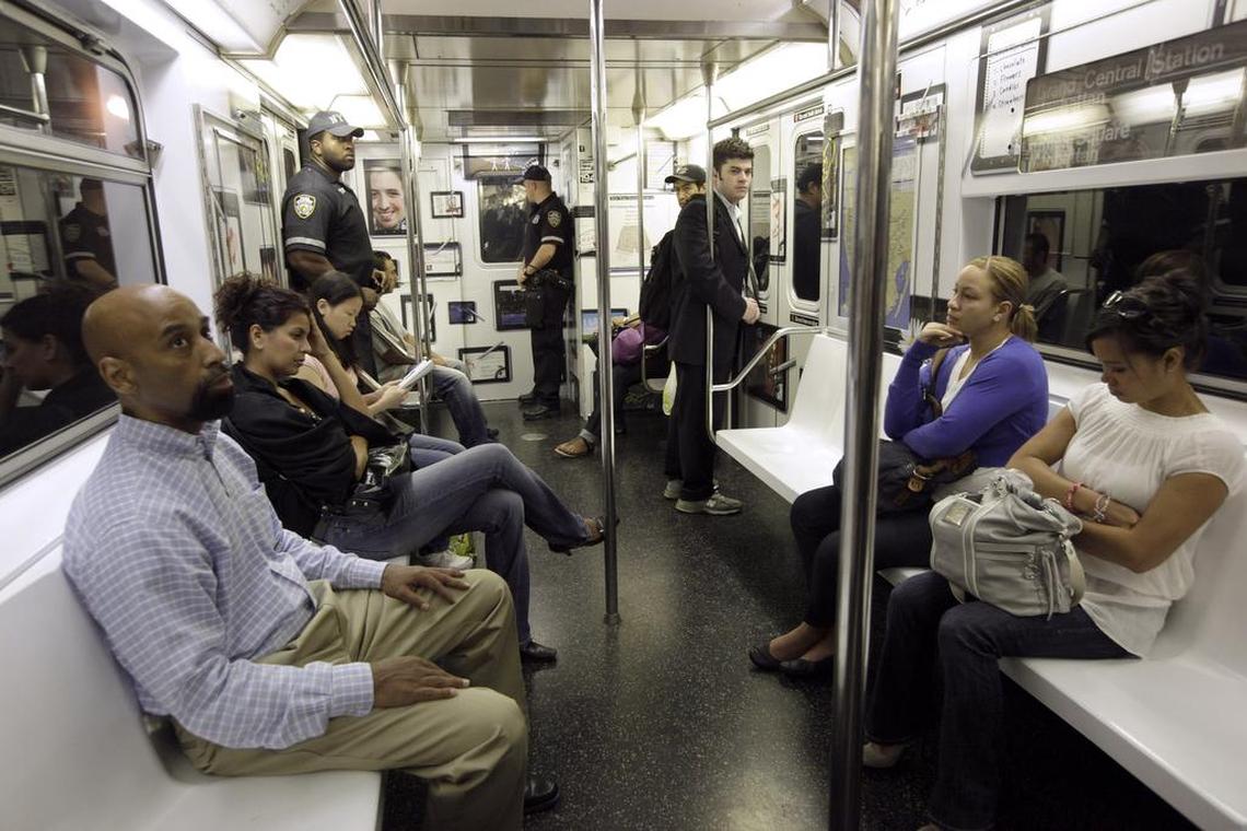 Passengers aboard a New York City subway train.