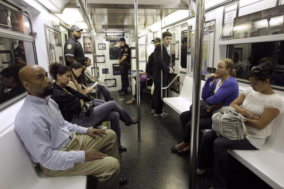 Passengers aboard a New York City subway train.