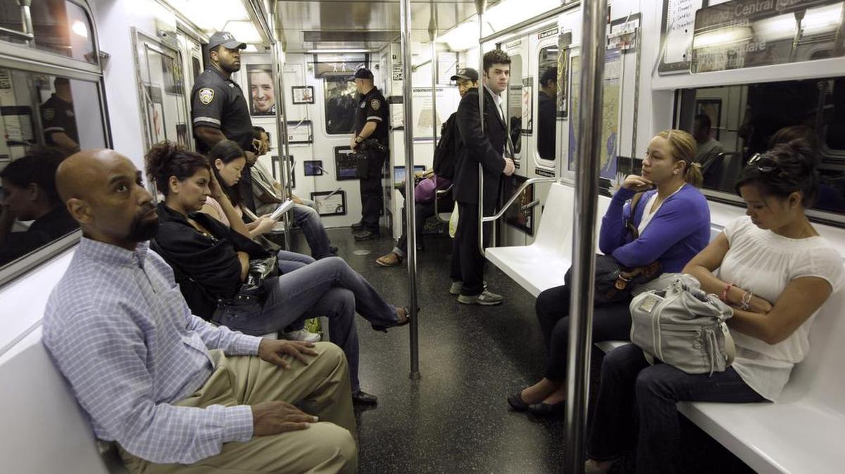Passengers aboard a New York City subway train.