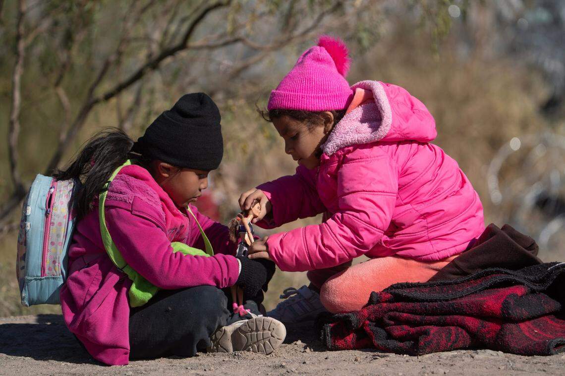 Migrant children play on the south bank of the Rio Grande on Dec. 18, 2024, after crossing the border.