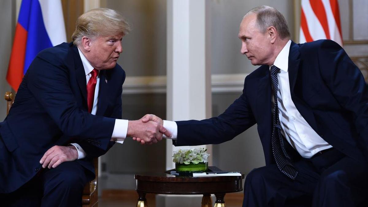 Russian President Vladimir Putin (R) and US President Donald Trump shake hands before a meeting in Helsinki, on July 16, 2018. / AFP PHOTO / Brendan SmialowskiBRENDAN SMIALOWSKI/AFP/Getty Images