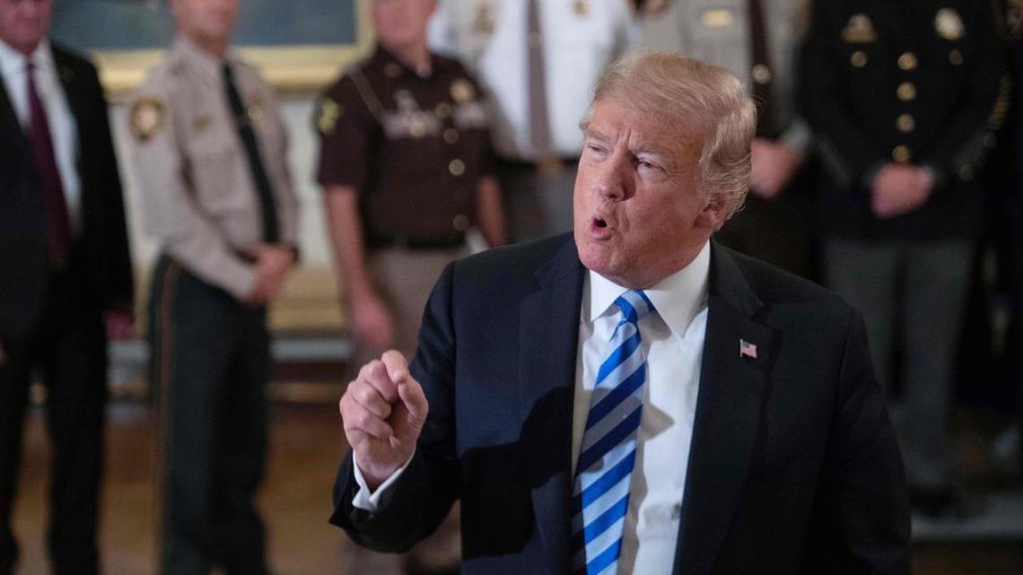President Donald Trump replies to a journalist during a meeting with sheriffs at the White House in Washington, DC, on September 5, 2018. Trump was responding to an anonymous senior official who wrote an op-ed article entitled “I Am Part of the Resistance Inside the Trump Administration” in The New York Times on Sept. 5.