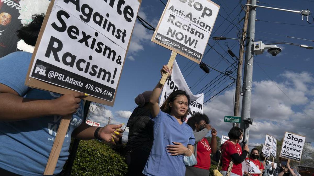 Kitana Truong joins others in rallying against anti-Asian and anti-female violence on Thursday in Atlanta. Georgia’s hate-crimes law includes race, gender and national origin in its protected categories, making it potentially applicable to this week’s shootings. MUST CREDIT: Photo by Elijah Nouvelage for The Washington Post
