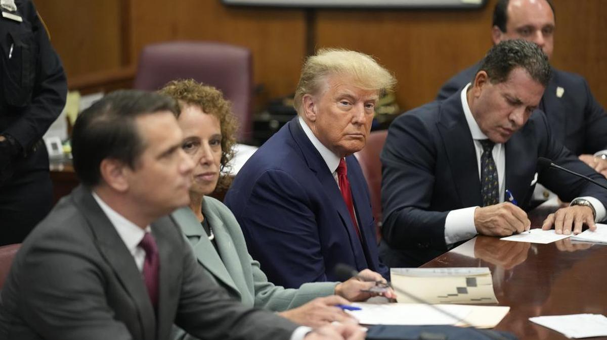 Former US President Donald J. Trump sits in the courtroom with his attorneys (L-R) Todd Blanche, Susan Necheles, Joe Tacopina and Boris Epshteyn before Judge Juan Merchan for his arraignment at the Manhattan Criminal Court on Tuesday, April 4, 2023, in New York. Trump pleaded not guilty to 34 felony counts related to hush money payments made to adult film star Stormy Daniels before the 2016 presidential election. (Photo by Seth Wenig/Pool/Sipa USA)
