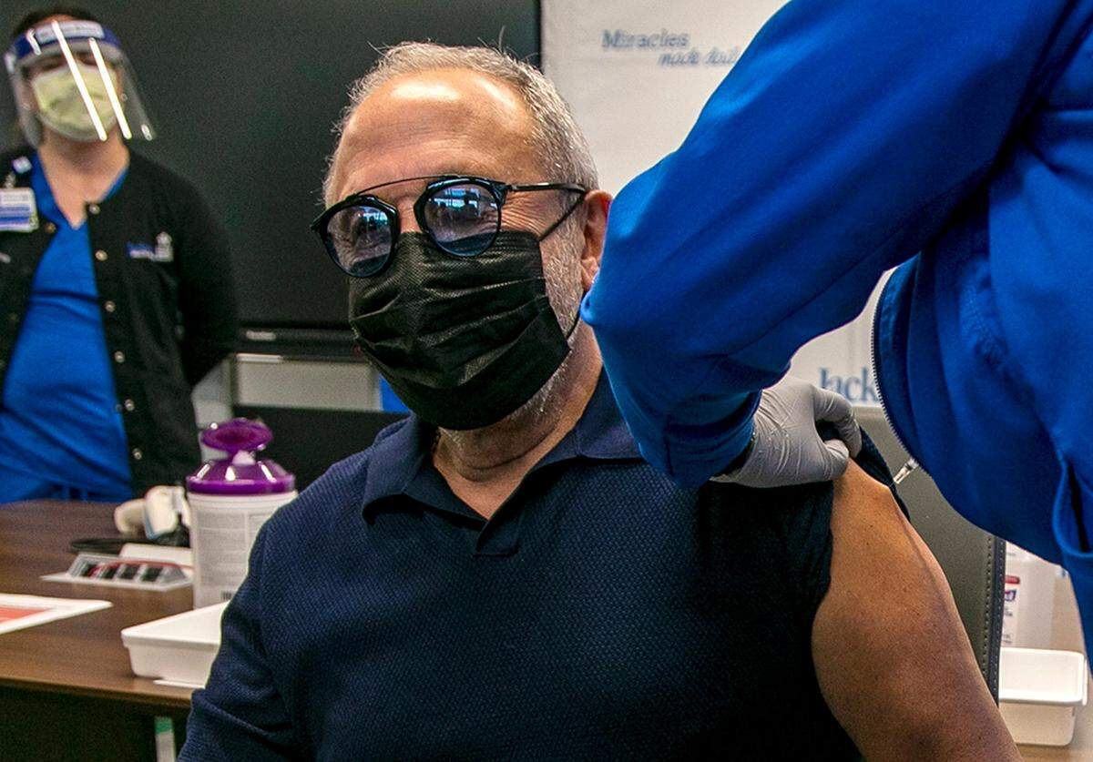 Music producer Emilio Estefan, 67, was among the first five Miami-Dade County residents to get the COVID-19 vaccine by RN Nadia Johnson at Jackson Memorial Hospital on Wednesday. Jackson Health System will receive nearly 15,000 doses of the Pfizer COVID-19 vaccine and is set to begin vaccinations for people 65 and older in Miami-Dade County. The vaccines are something to celebrate as 2021 begins.