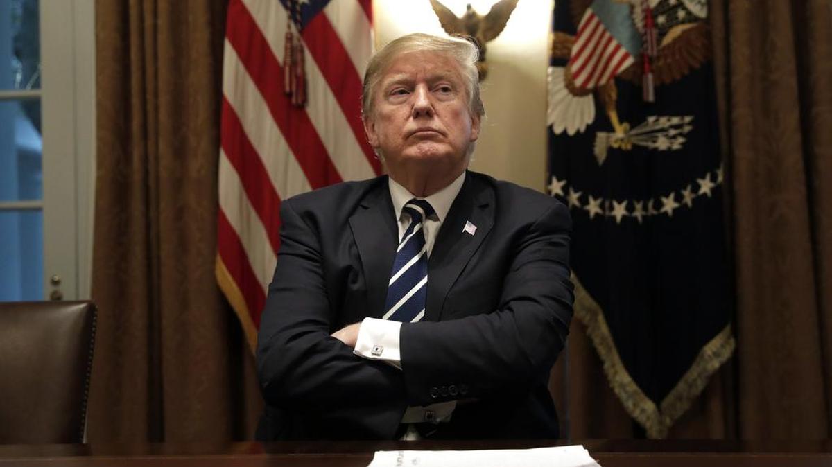 U.S. President Donald Trump listens during a meeting with members of Congress at the White House this week. MUST CREDIT: Bloomberg photo by Yuri Gripas