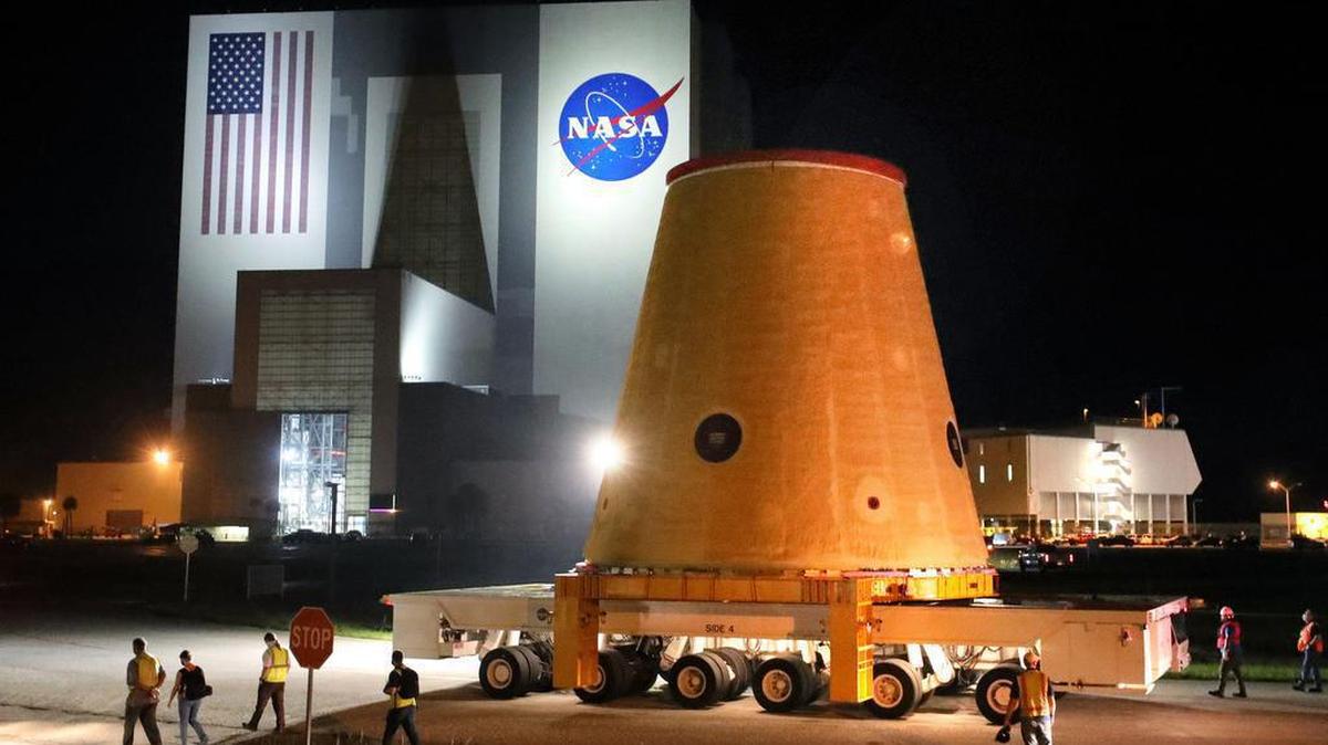 A piece of the Artemis 1 rocket is transported at Kennedy Space Center, Fla., before sunrise Thursday, July 30, 2020, after making a 13-day journey on a barge from NASA’s Marshall Space Flight Center in Huntsville, Alabama. The section is a stage adapter for NASA’s massive Space Launch System rocket, which is under development for crewed lunar flights in the Artemis mission, with future plans for possible human missions to Mars.(Joe Burbank/Orlando Sentinel/TNS)