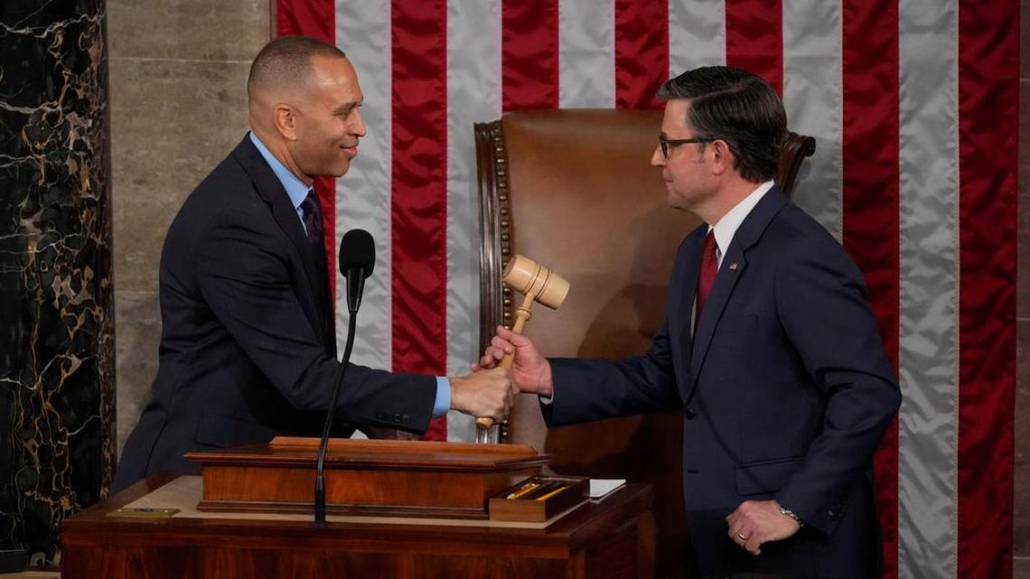 House Minority Leader Hakeem Jeffries, D-N.Y., hands Speaker of the House Mike Johnson the gavel during the first session of the 119th Congress at the US Capitol in Washington, DC, on Jan. 3, 2025.