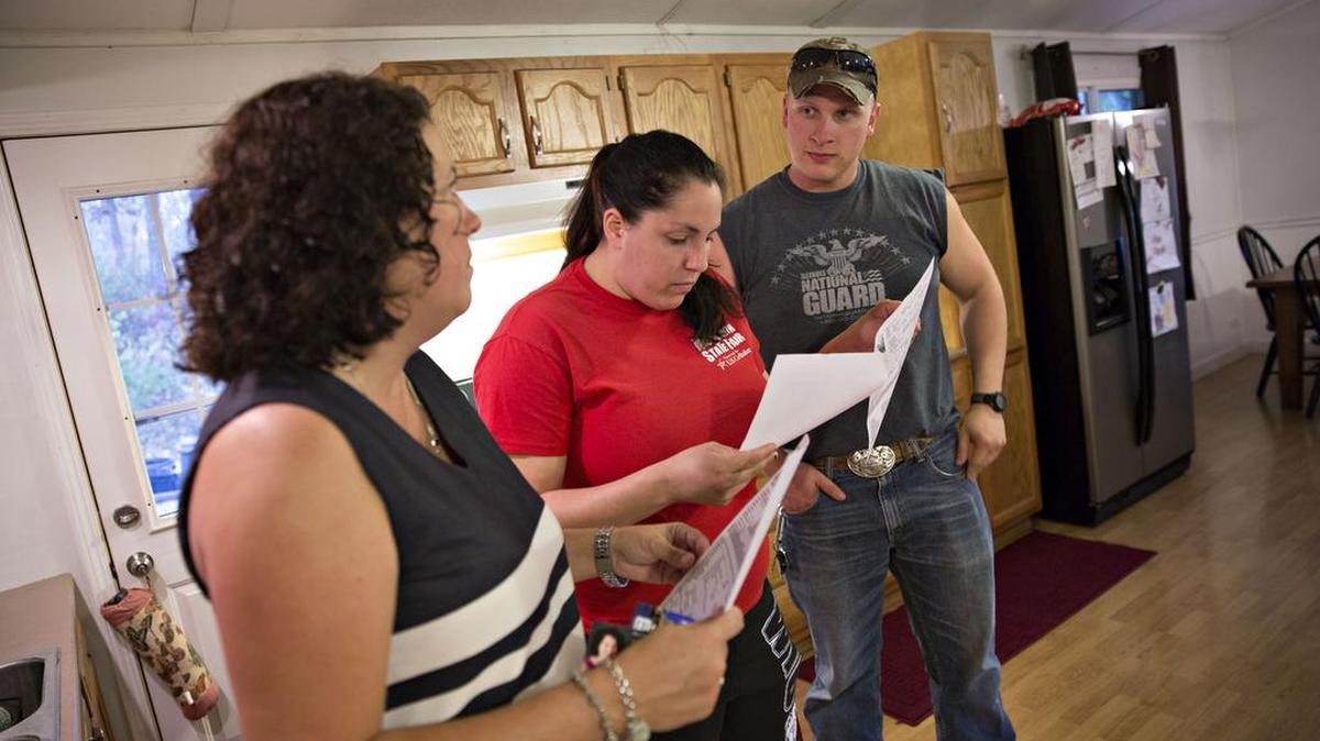 Above: A broker shows a single-family home to prospective buyers in October 2015.