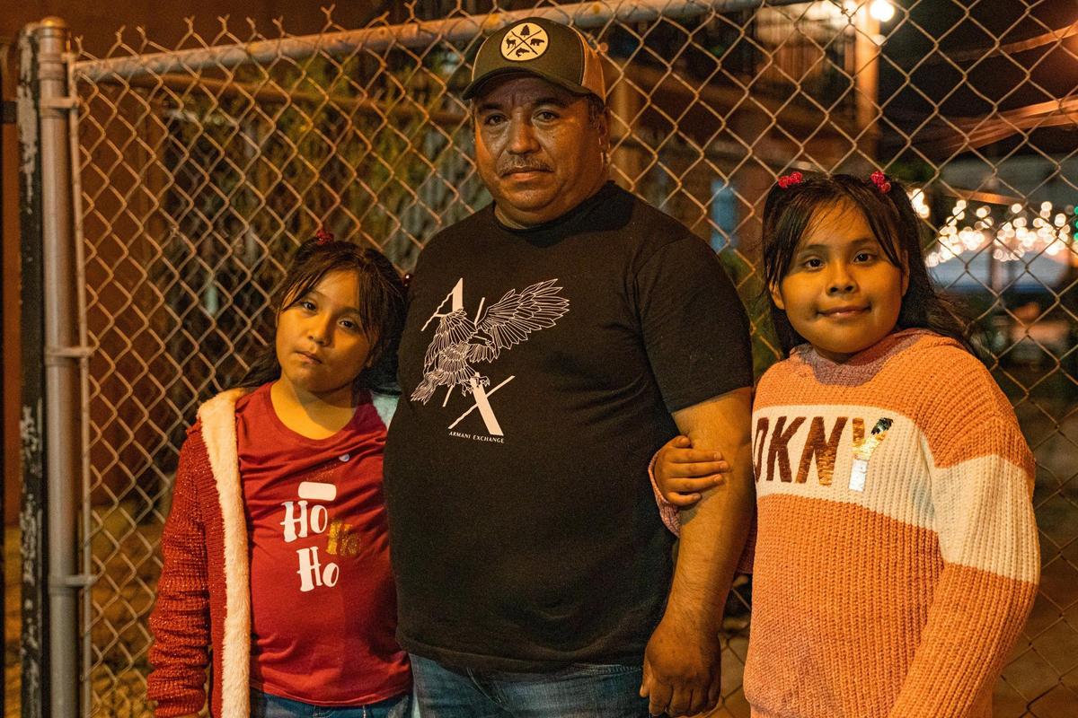 Catarino Arreguín and his daughters Abigail, 7, left, and Brenda, 8, live in Homestead.