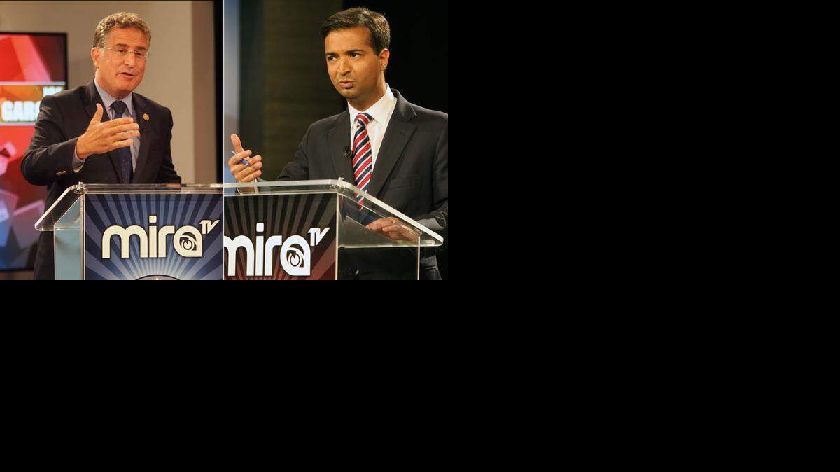 
El representante Joe García, a la izquierda, y el retador Carlos Curbelo, en un debate de octubre
