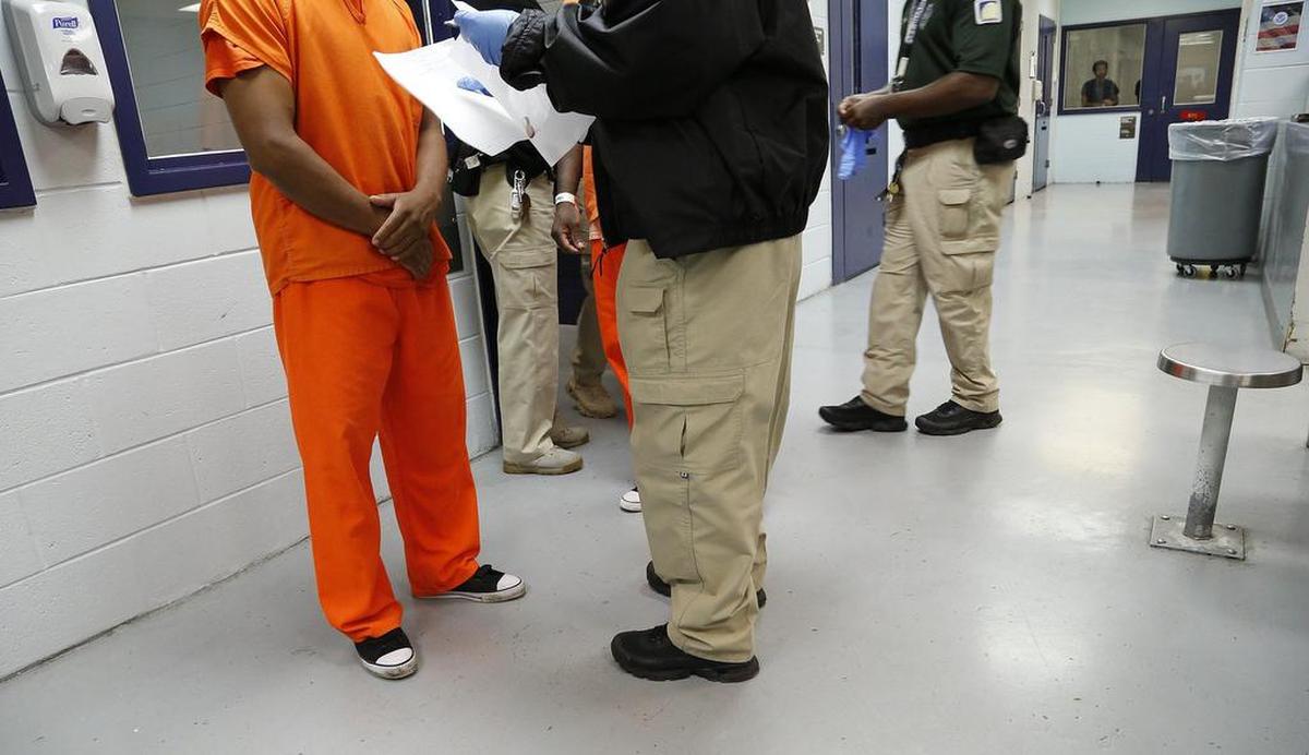 Miami, September 24, 2015 Tour inside Krome Detention Center in 2015. A detainee is processed by a guard in the Medical Unit.