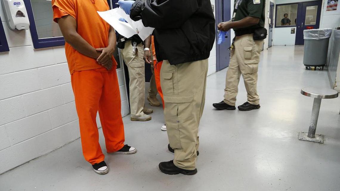 Miami, September 24, 2015 Tour inside Krome Detention Center in 2015. A detainee is processed by a guard in the Medical Unit.