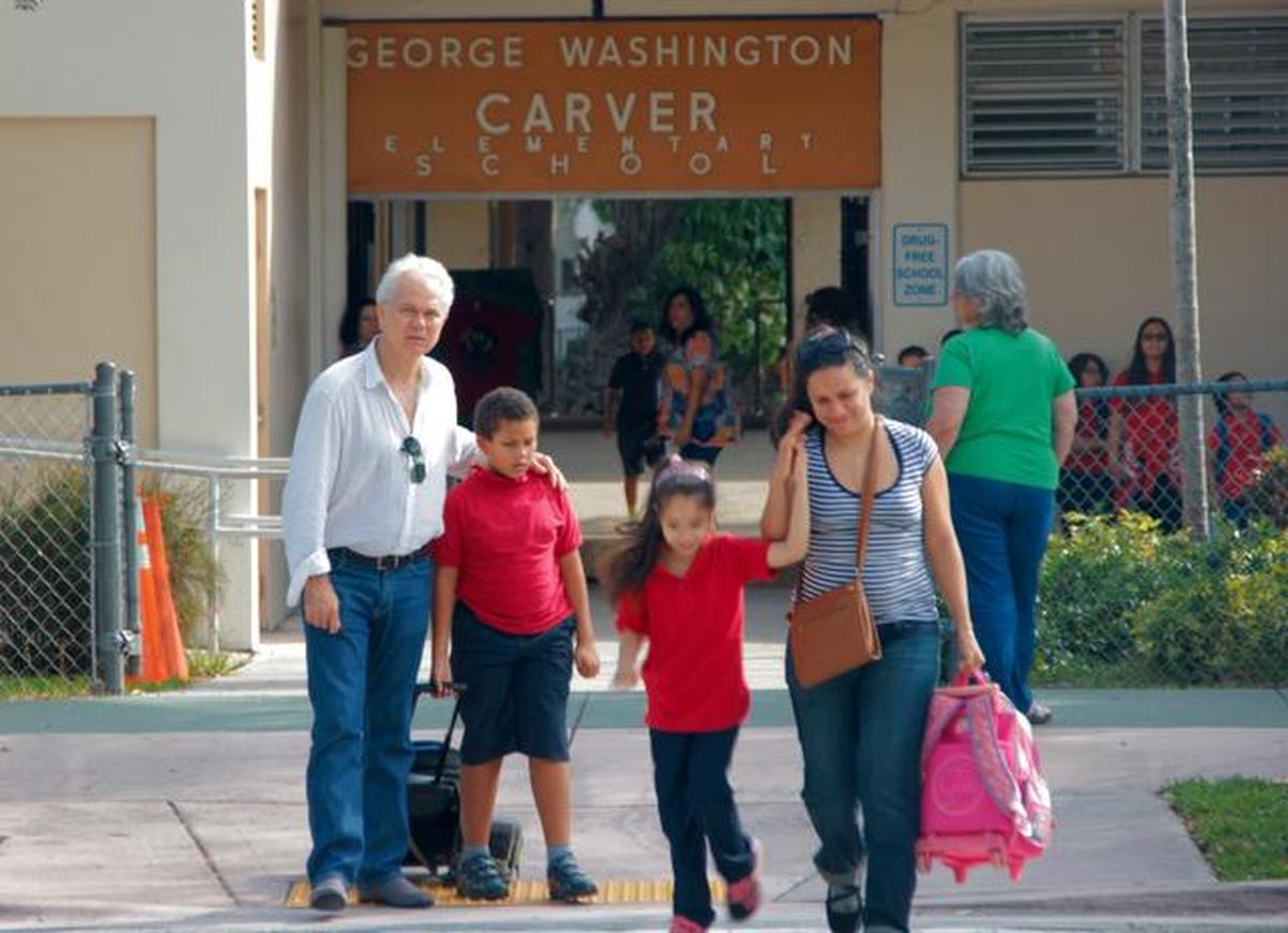 Parents pick up their children after school at George Washington Carver Elementary, located on Grand Avenue, across the street from where a gas station and WAWA are slated to be built.