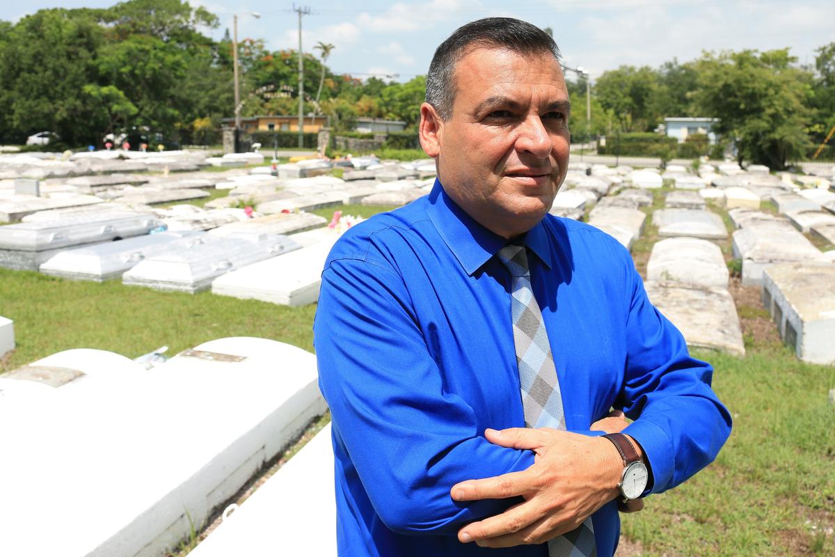 Carlos Joel Bencomo, president of the Bencomo Foundation, in the Charlotte Jane Memorial Park Cemetery in June 2019.