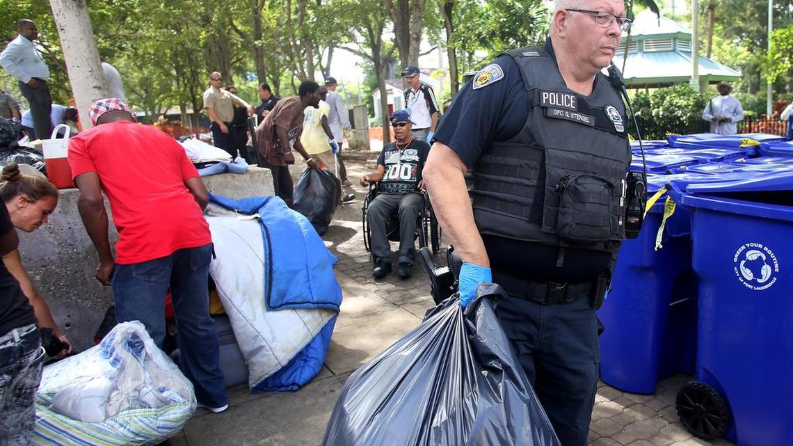 Police officers during the eviction of a homeless encampment located in Stranahan Park in downtown Fort Lauderdale on May 19, 2017.