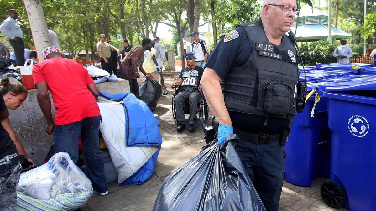 Police officers during the eviction of a homeless encampment located in Stranahan Park in downtown Fort Lauderdale on May 19, 2017.