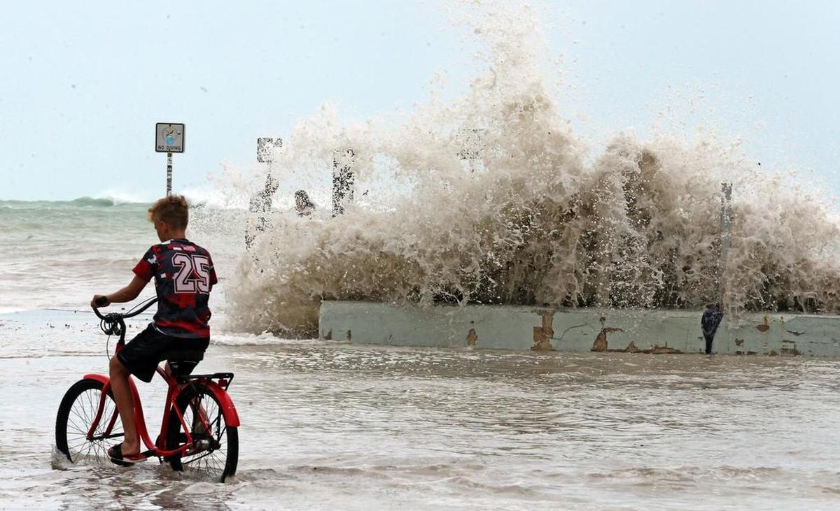 A Key West resident watches the waves hit a dam in on Sept. 9, 2017. Thousands of residents of the Florida Keys had to evacuate their homes due to the arrival of Hurricane Irma.